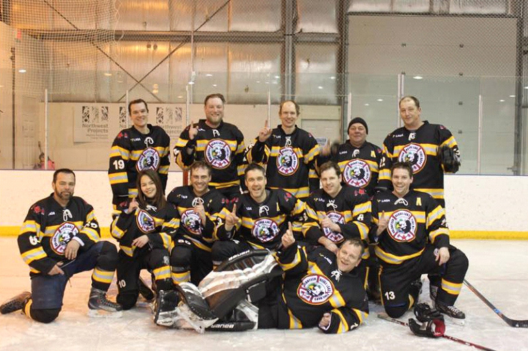 Star West community-sponsored hockey team — team photo on the ice